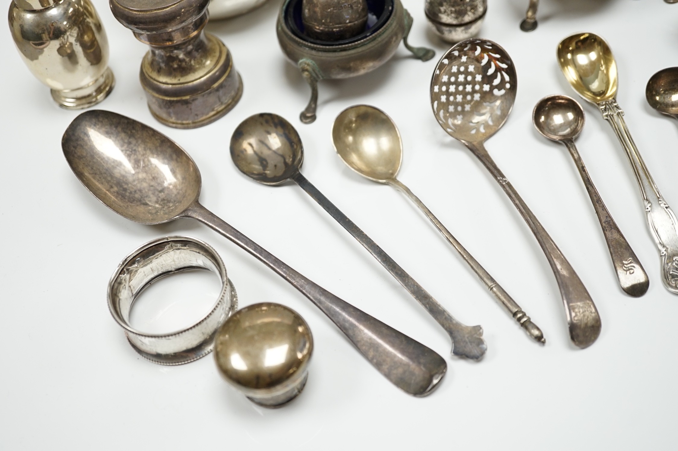Sundry small silver including a Guernsey can milk jug, mustard pot, damaged mounted glass hip flask, flatware and minor plated wares.